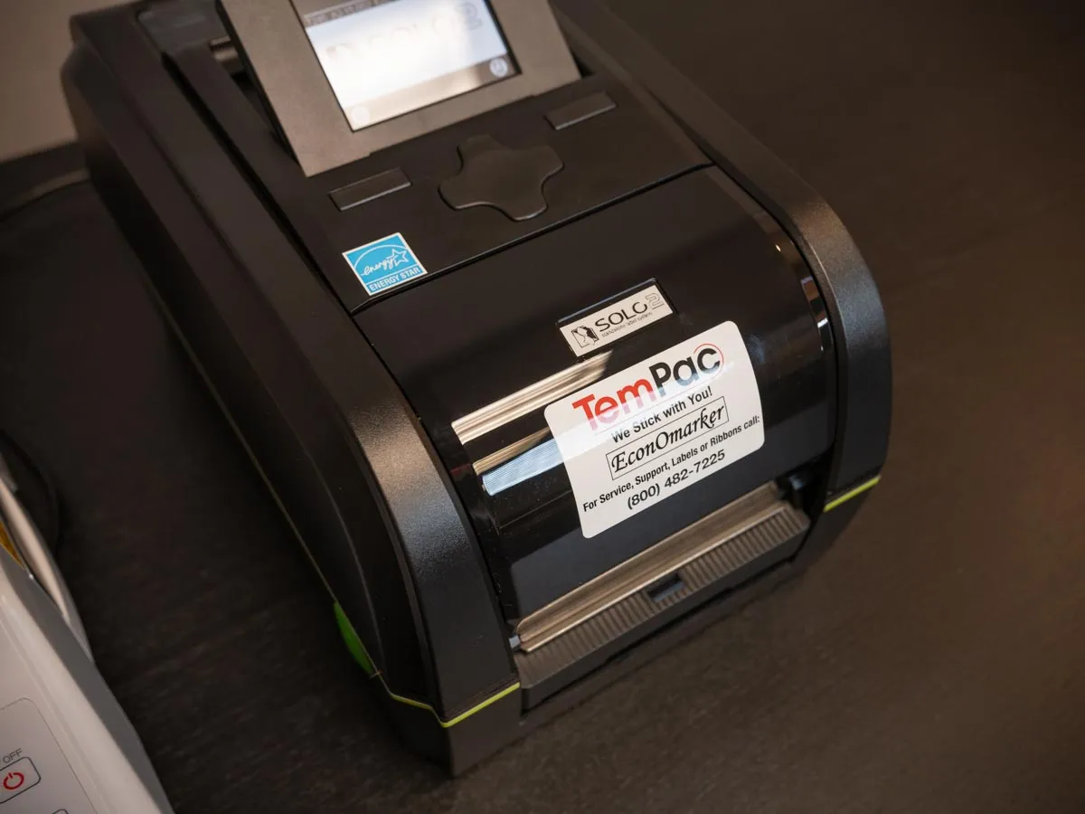 Close-up of the Solo printer's screen and keypad with a TemPac EconOmarker label on the front