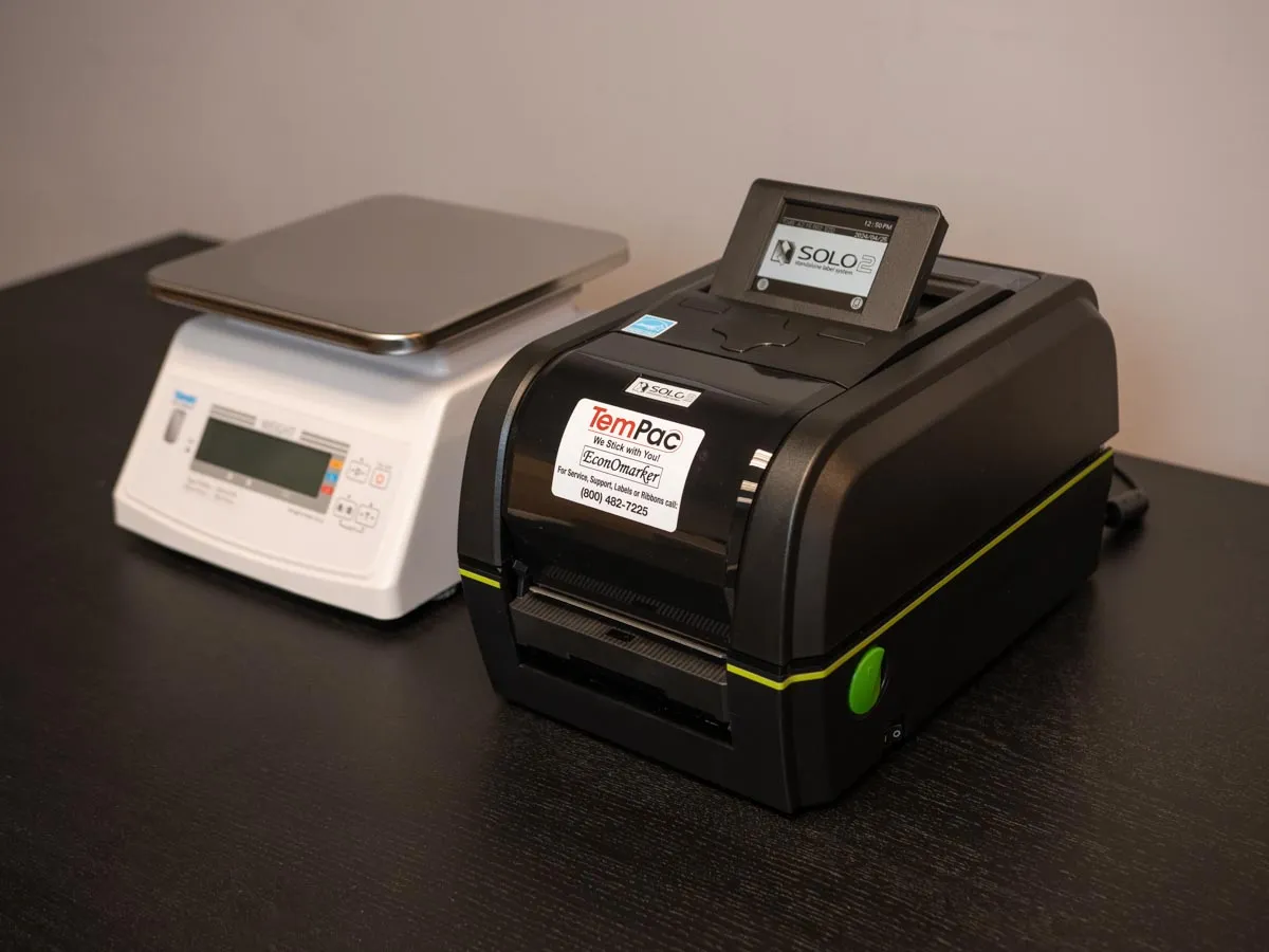 Economarker system: a Yamato bench scale beside a Solo label printer