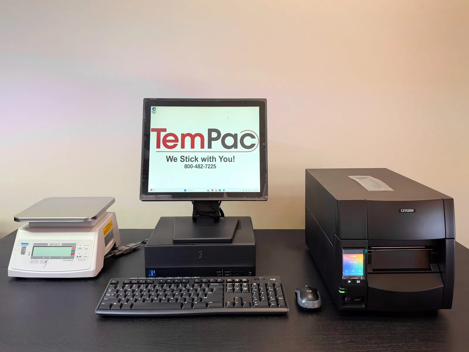 ScaleManager system: a Yamato bench scale, a PC with a touchscreen monitor showing the TemPac logo, a keyboard and mouse, and an industrial label printer